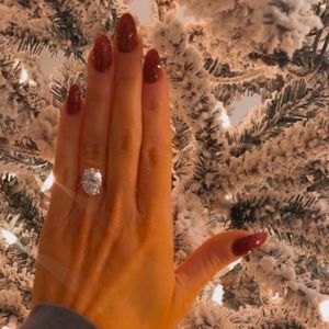 6 carat Oval Moissanite engagement ring with hidden halo set in 10k white gold